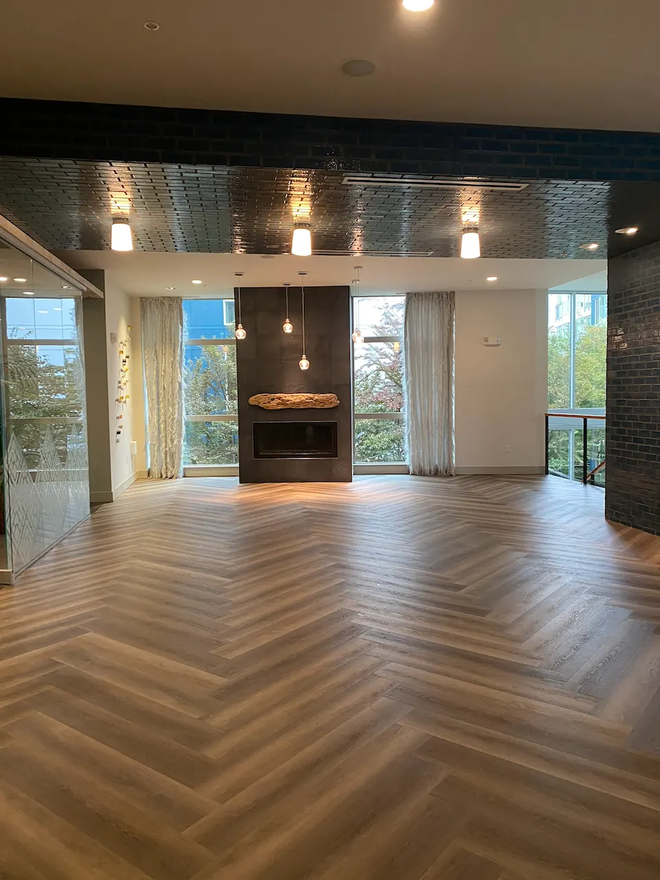 Herringbone luxury vinyl plank installed in a Seattle apartment building lobby
